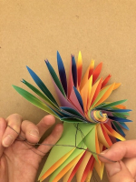 Step 15 12 petal kusudama: Knot the 12 petals together tightly