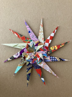 Step 13 starfish mandala: Fold outer edges into middle.
