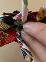 Step 21 starfish mandala: Add string for a mobile.