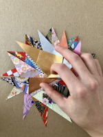Step 5 starfish mandala: Fold the edge of one point inwards.