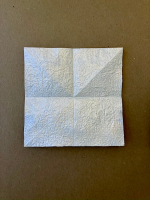 Step 1 16 piece modular pinwheel: Start with a square of paper and fold in half, four different ways.