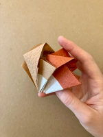 Step 12 16 piece modular pinwheel: Interlock two units.