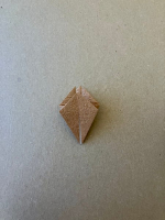 Step 5 16 piece modular pinwheel: Rotate and fold flaps over on front and back.