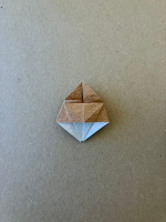 Step 6 16 piece modular pinwheel: Squash fold down.