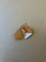 Step 9 16 piece modular pinwheel: Fold the left flap over.